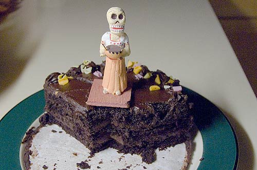 chocolate cake with a Day of the Dead figure
