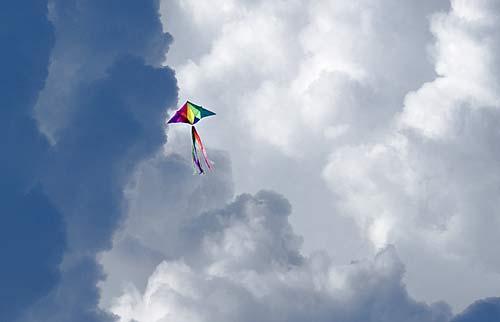 photo of kite near thunderstorm