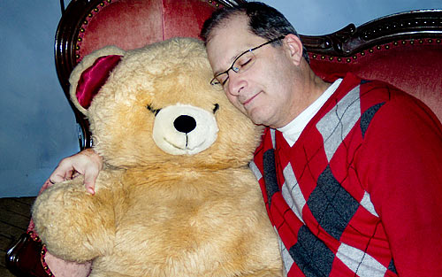Man sleeping with teddy bear