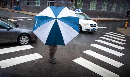 friendly passerby holds my umbrella