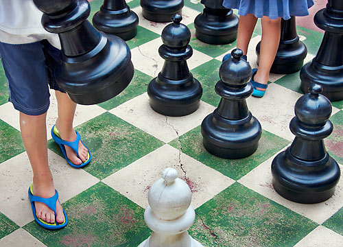 brother and sister playing chess