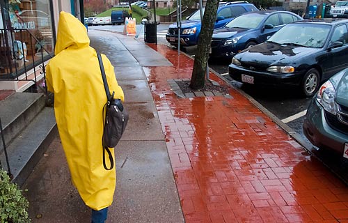 Person in hooded raincoat