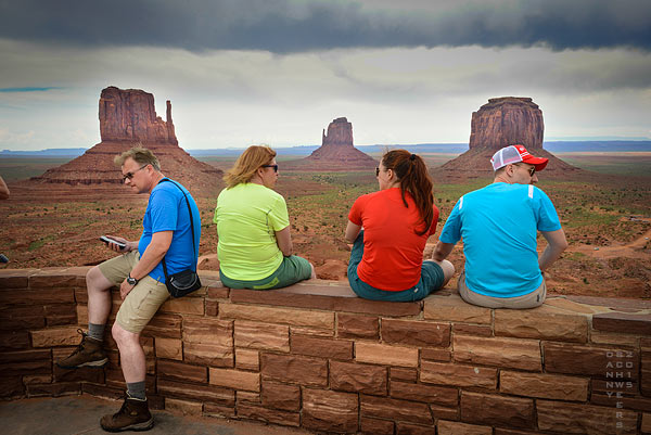 Colorful tourists at Monument Valley, Navajo lands, Arizona and Utah.