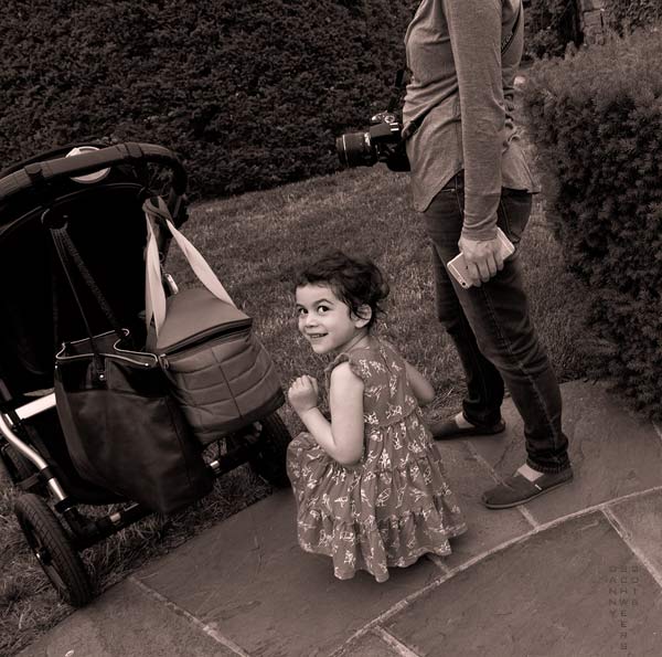Hide and Seek Girl Photo of a girl hiding during a game of hide and seek by Danny N. Schweers