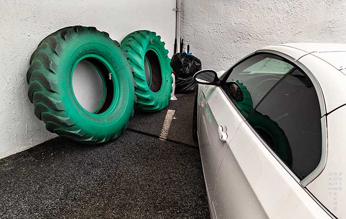 Photo of two tractor tires painted green at Brandywine River Antiques Market, Chadds Ford, PA by Danny N. Schweers, 2019