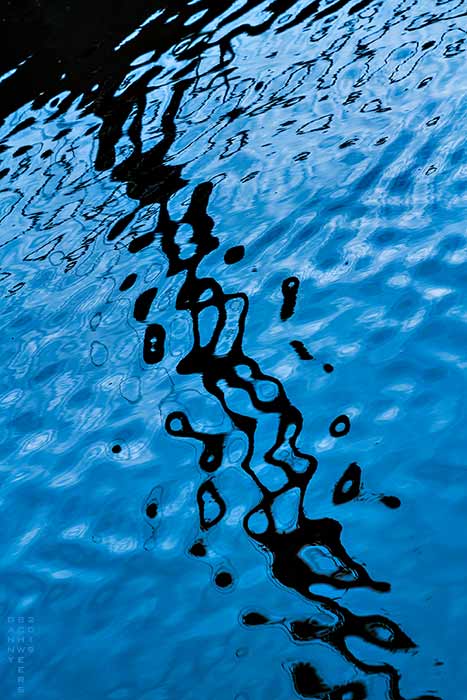 Reflections at holding pond, wastewater treatment plant, Wilmington, DE by Danny N. Schweers