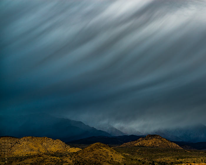 Photo of storm over Big Point Mountain, Utah, seen from Zion National Park, November, 2012 by Danny N. Schweers, 2003.