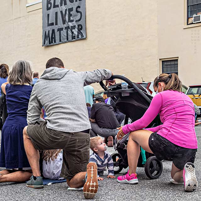 Photo of people kneeling in prayer at the Episcopal Church of Saints Andrew and Matthew, Wilmington, Delaware, on June 19, 2020 by Danny N. Schweers