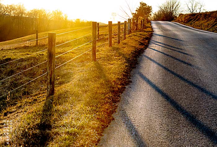 Fields and a country road in Chester County, Pennsylvania near sunset by Danny N. Schweers