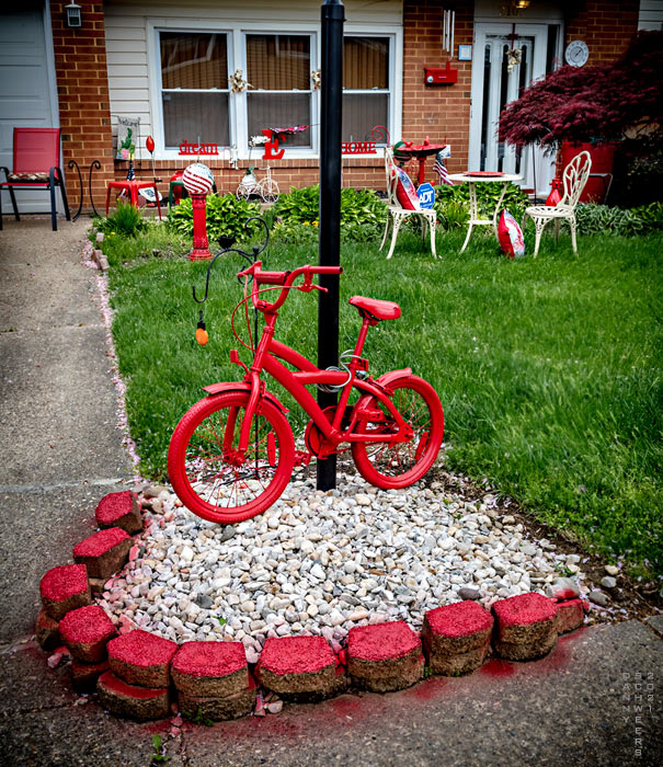 Photo of red objets d'art in the front yard of a Clair Manor subdivision home, New Castle County, Delaware, copyright 2021 by Danny N. Schweers.